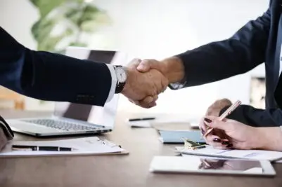 Business people shaking hands together Business people shaking hands together